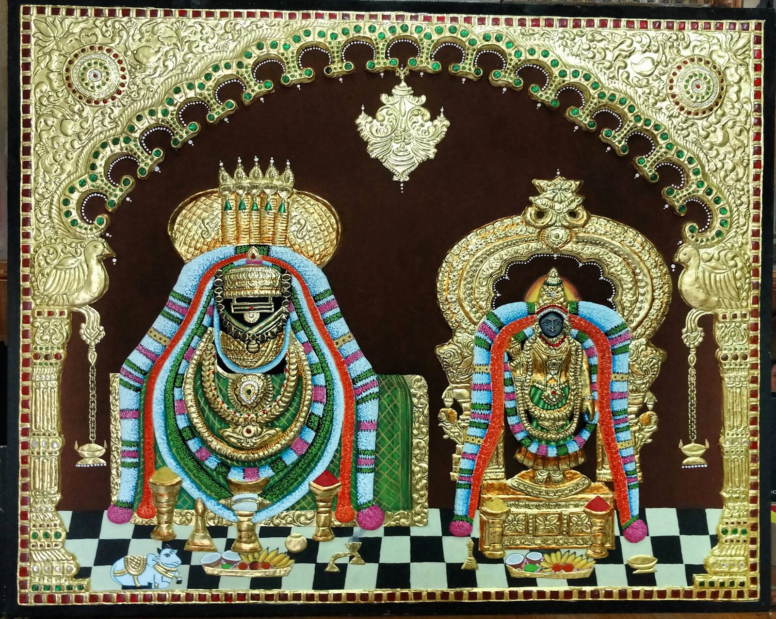Two ornate embossed Tanjore paintings completed by students